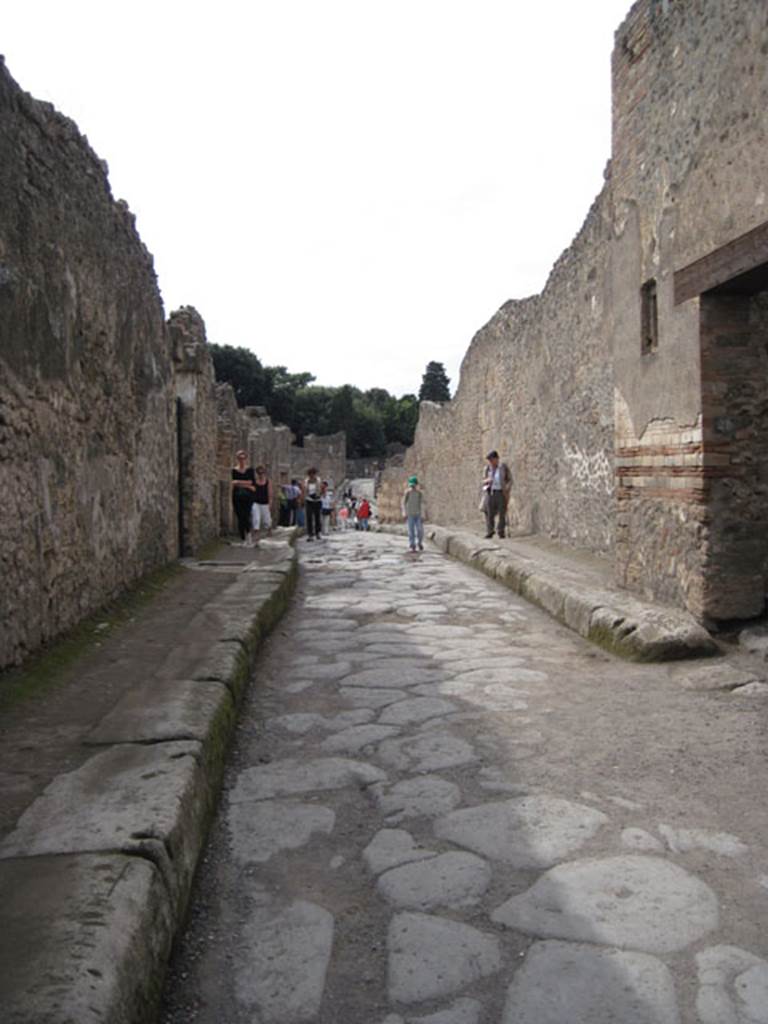 I.3.24 Pompeii. September 2010. Looking west along Vicolo del Menandro between I.3 and I.4, from outside entrance doorway.  Photo courtesy of Drew Baker.
