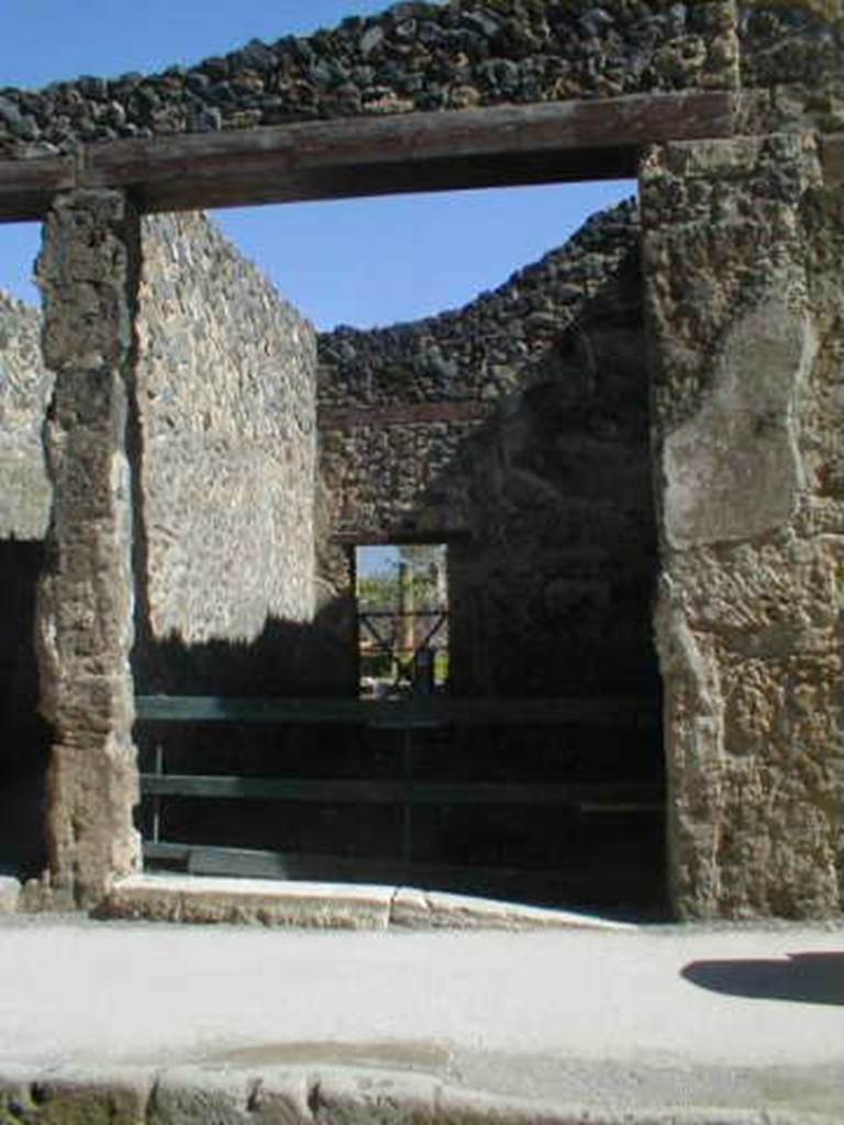 I.8.4 Pompeii. May 2005. Entrance doorway on Via dell Abbondanza.