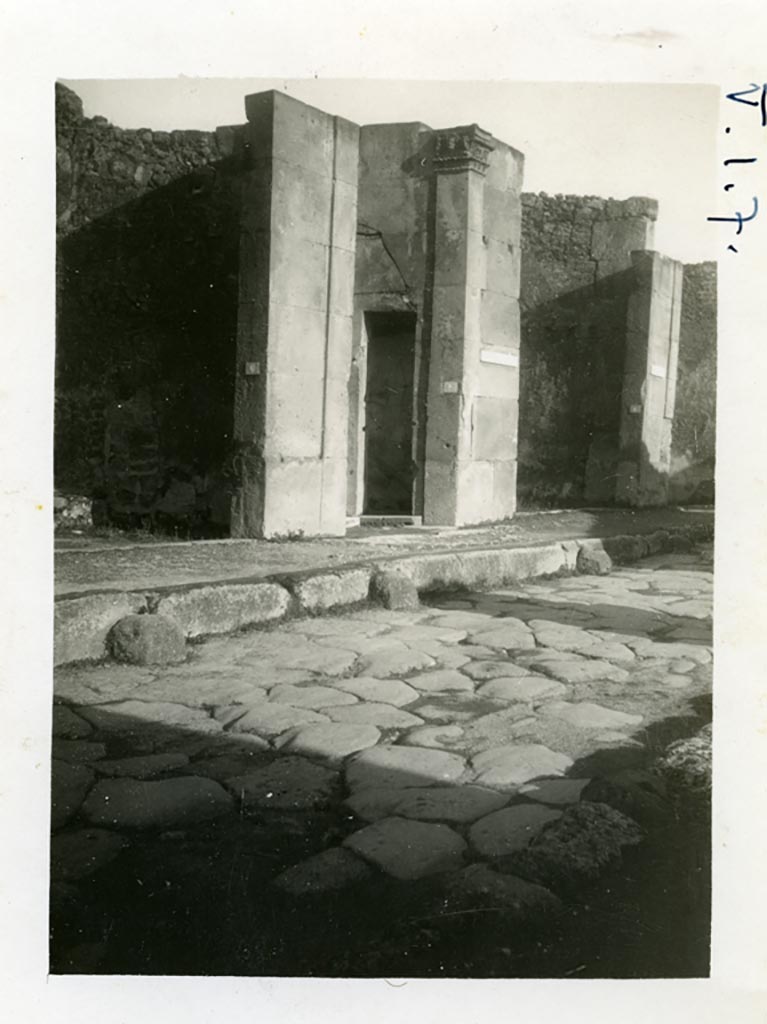 V.1.7 Pompeii. Pre-1937-39. Looking north-east on Via di Nola towards entrance doorway.
On the right side of the main entrance doorway 1, the doorway to small room 2, can be seen.
Photo courtesy of American Academy in Rome, Photographic Archive. Warsher collection no. 1482.


