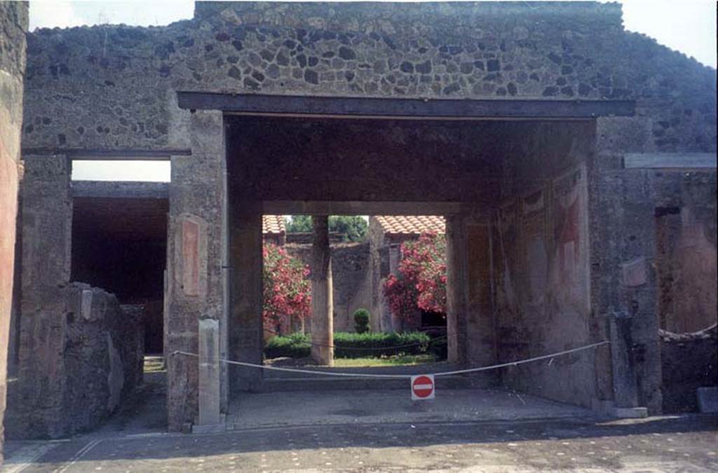 V.1.26 Pompeii. July 2011. Room “b”. 
Looking east from atrium “b” into tablinum “i”, with the two pilasters for the herms remaining on either side of the tablinum. 
Photo courtesy of Rick Bauer.
According to Niccolini, two herms were found, one on either side of the tablinum.
The one on the left was taken to the Naples Archaeological Museum, see below.
While the other herm, on the right, which was still in situ, had its head destroyed by later burrowers or diggers, after the eruption.
See Niccolini F, 1890. Le case ed i monumenti di Pompei: Volume Terzo. Napoli, (page 1 of La Casa del Banchiere L. Cecilio Giocondo).


