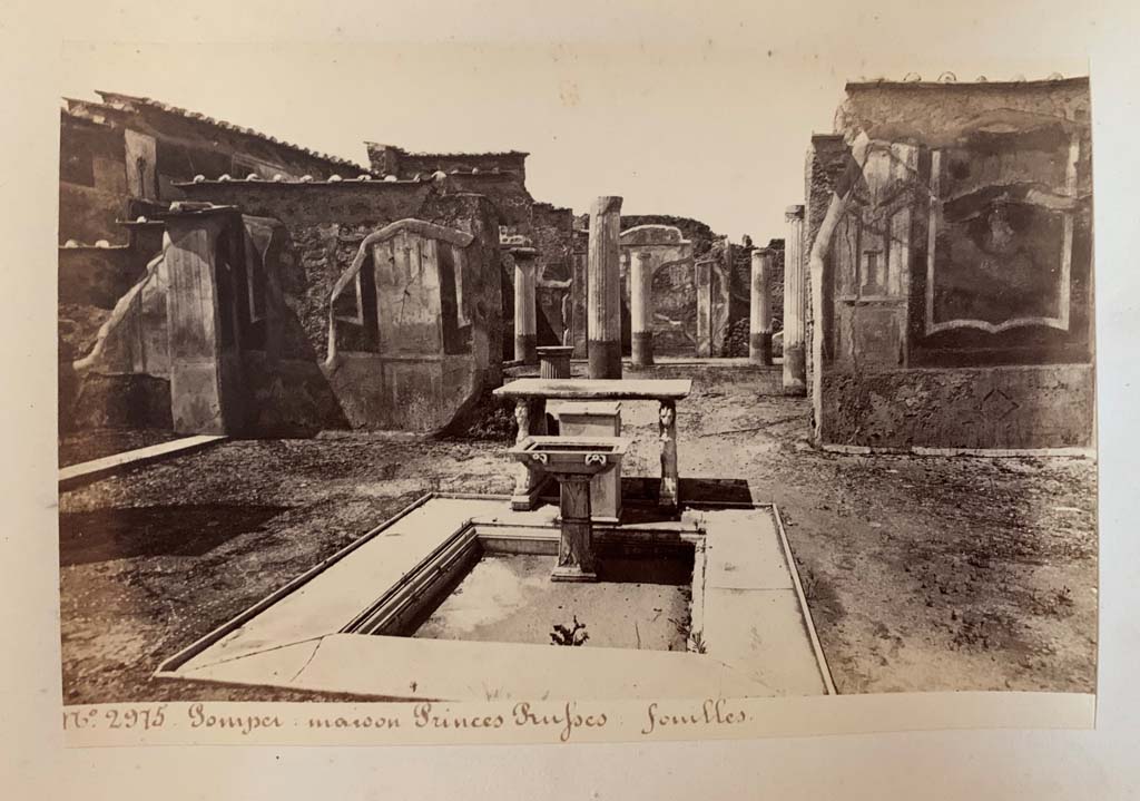 VII.1.25 Pompeii. Photograph by M. Amodio, from an album dated April 1878. 
Looking west across impluvium in atrium 24 towards doorway to peristyle 31. Photo courtesy of Rick Bauer.

