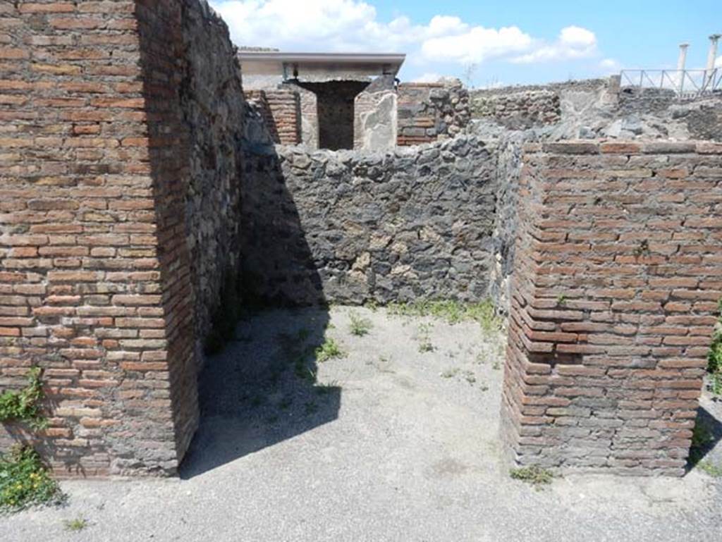 VIII.2.3 Pompeii. May 2018. Looking north towards room in north-east corner of peristyle garden.
On the right of this room is a passageway leading to VIII.2.4. Photo courtesy of Buzz Ferebee.
According to the plan by Mazois and Breton, this “passageway” was in fact, steps to the upper floor.
See Mazois, F., 1824. Les Ruines de Pompei : Second Partie. Paris: Firmin Didot, p.61, (part of. Pl. XXI).
See Breton, Ernest. 1855. Pompeia, decrite et dessine : Seconde édition. Paris, Baudry. p.340-341 (part of plan on p.340).

