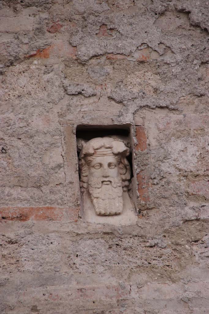 IX.7.1 Pompeii. December 2018. 
Dionysus in niche on east side of doorway. Photo courtesy of Aude Durand.

