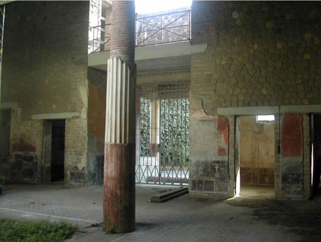 Villa San Marco, Stabiae, December 2007. 
Room 44, looking towards south side of atrium, with doorway to room 61 on left, entrance 56 (centre) and room 57 on right.
