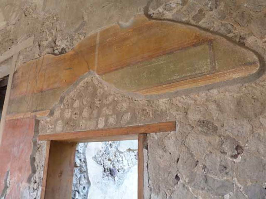 Villa of Mysteries, Pompeii. May 2010. Painted wall above doorway to room 33.