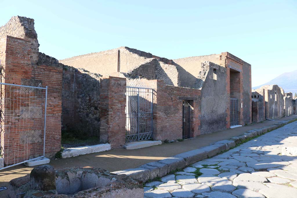 Via delle Scuole, west side, Pompeii. December 2018. 
Looking north from VIII.2.19, on left, towards VII.2.17, VII,2,16, etc. Photo courtesy of Aude Durand.
