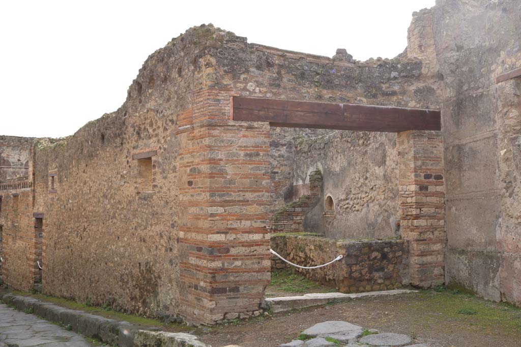 Vicolo del Lupanare, west side. December 2018. Looking south-west to entrance doorway at VII.12.15. Photo courtesy of Aude Durand.