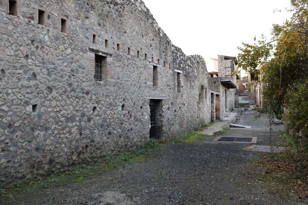 Vicolo di Paquius Proculus. December 2018. 
Looking north along west side, towards doorways to I.10.15 (centre), 16, 17 and 18. Photo courtesy of Aude Durand.

