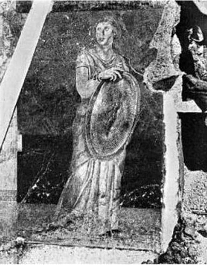Villa of P Fannius Synistor at Boscoreale 1900.  Room H south end of east wall. In situ excavation photo of standing woman holding a gold shield. 