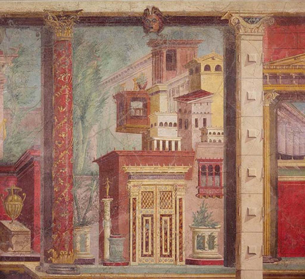 Villa of P Fannius Synistor at Boscoreale. Cubiculum M, second panel from north end of west wall. Panel painted with buildings, an ornate door, an altar and a statue on a column. At the top of the panel is a mask and on the left a red column ornately painted with flowers and climbers. The painting also has a considerable amount of detail not visible in the photo. The square column on the right marks the division between the end of the cubiculum and the start of the alcove. According to Barnabei, this square column, separated two distinct decorations, that of the front room and that of the alcove. Both however were within the same architectural structure, the Corinthian order, as in the other rooms. See Barnabei F., 1901. La villa pompeiana di P. Fannio Sinistore. Roma: Accademia dei Lincei. p. 71-81.