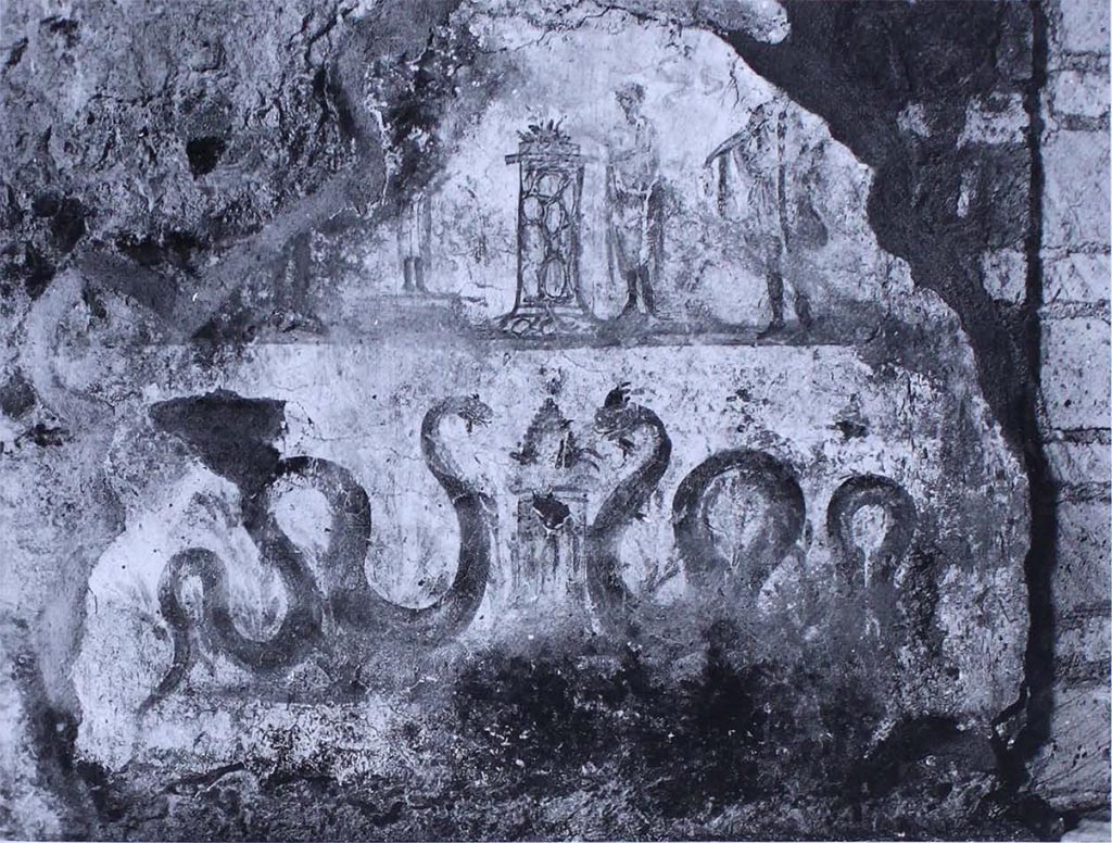 VII.16.22 Pompeii. Lararium painting on south wall of room 28.
The scene is divided, as frequently, between a lower area, with snakes on the sides of an altar, and an upper area, in which the Lares are represented (the one on the left is almost completely lost), who assist the sacrifice at an altar.
As is known, this is a type of decoration that was renewed very frequently, and it is therefore very probable that this lararium can be assigned to the last years of the city.
See Carratelli, G. P., 1990-2003. Pompei: Pitture e Mosaici. Roma: Istituto della enciclopedia italiana, (p. 977, no. 51.)

