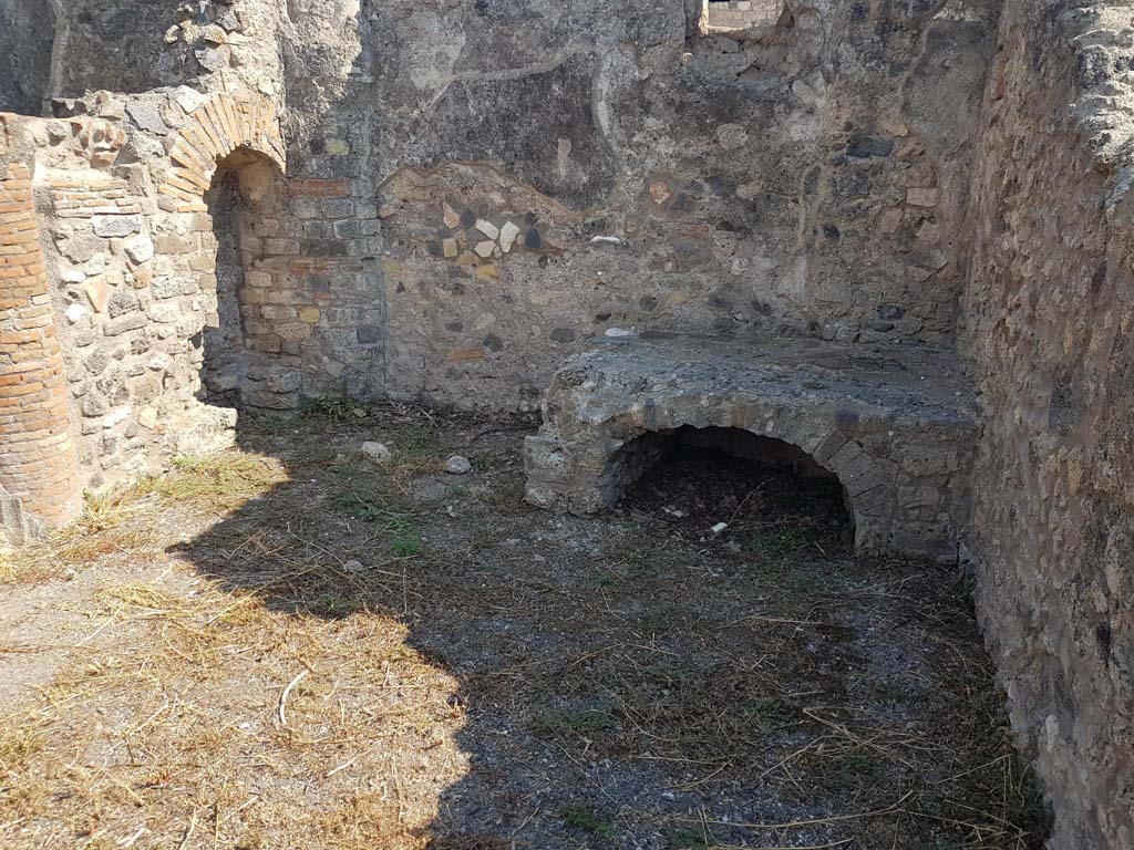 VIII.3.16 Pompeii. September 2021. Looking south in kitchen, with “niche” latrine, on left. Photo courtesy of Klaus Heese