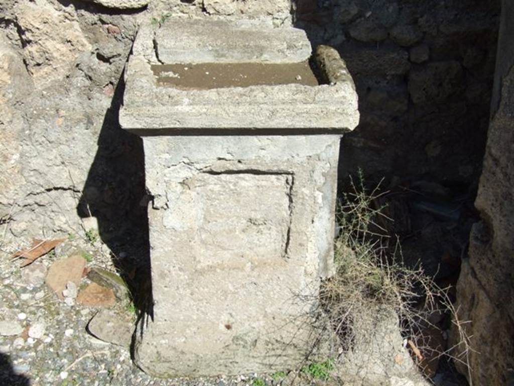 VIII.5.2 Pompeii. March 2009. Room 1, altar. According to Boyce, in the north wall of the atrium, to the right of the entrance doorway from the street, is a recess. A square masonry altar stands more-or-less in the centre of the recess. On the top of the altar on its upper surface is a large rectangular depression. According to Fiorelli, on the right of the tuscanic atrium was a sacrarium, three cubicula and an ala.
See Boyce G. K., 1937. Corpus of the Lararia of Pompeii. Rome: MAAR 14. (p.76, no.365, Pl.39,2) 
See Pappalardo, U., 2001. La Descrizione di Pompei per Giuseppe Fiorelli (1875). Napoli: Massa Editore. (p.163)
