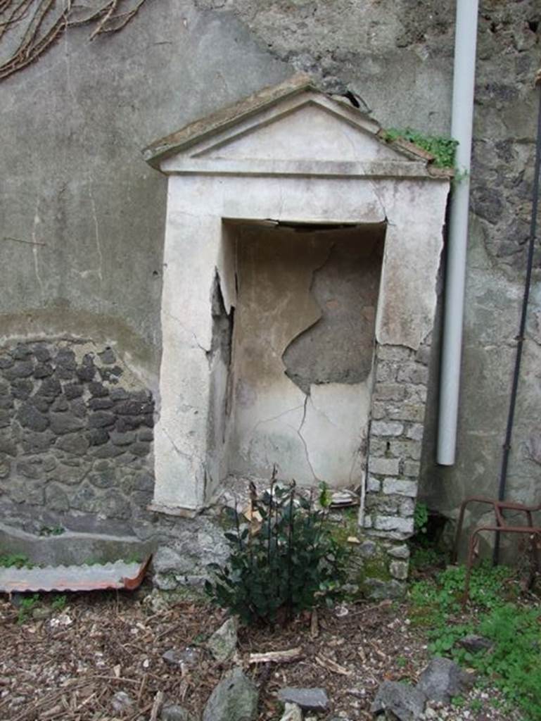 IX.7.20 Pompeii. December 2007. Aedicula with niche on north side of fountain, looking west.
According to Boyce -
When excavated this one, found on the north side (to the right) contained the following terracotta statues –
Asclepius with snake, Bacchus with a leopard, a clothed woman holding a bird, and fragments of a fourth – perhaps Minerva.
Also found was a small terracotta bird resembling a dove on a cylindrical base.
See Boyce G. K., 1937. Corpus of the Lararia of Pompeii. Rome: MAAR 14. (p. 89, no.446) 
See Jashemski, W. F., 1993. The Gardens of Pompeii, Volume II: Appendices. New York: Caratzas. (p.242-3, no.504, location given as IX.7.25).
According to Kuivalainen, one of the group of terracotta figures, Bacchus (Now in Naples Archaeological Museum, inventory number 116664), was discovered with traces of colour; the left hand of the youth and the head of the animal are missing.
Kuivalainen comments –
The figurine follows the customary model of the marble statues depicting a young Bacchus giving wine to a panther. It was not, however, a popular subject as a terracotta figurine, nor in bronzes. As it was discovered in a lararium it surely had religious meaning.
See Kuivalainen, I., 2021. The Portrayal of Pompeian Bacchus. Commentationes Humanarum Litterarum 140. Helsinki: Finnish Society of Sciences and Letters, (H11, p.217).

