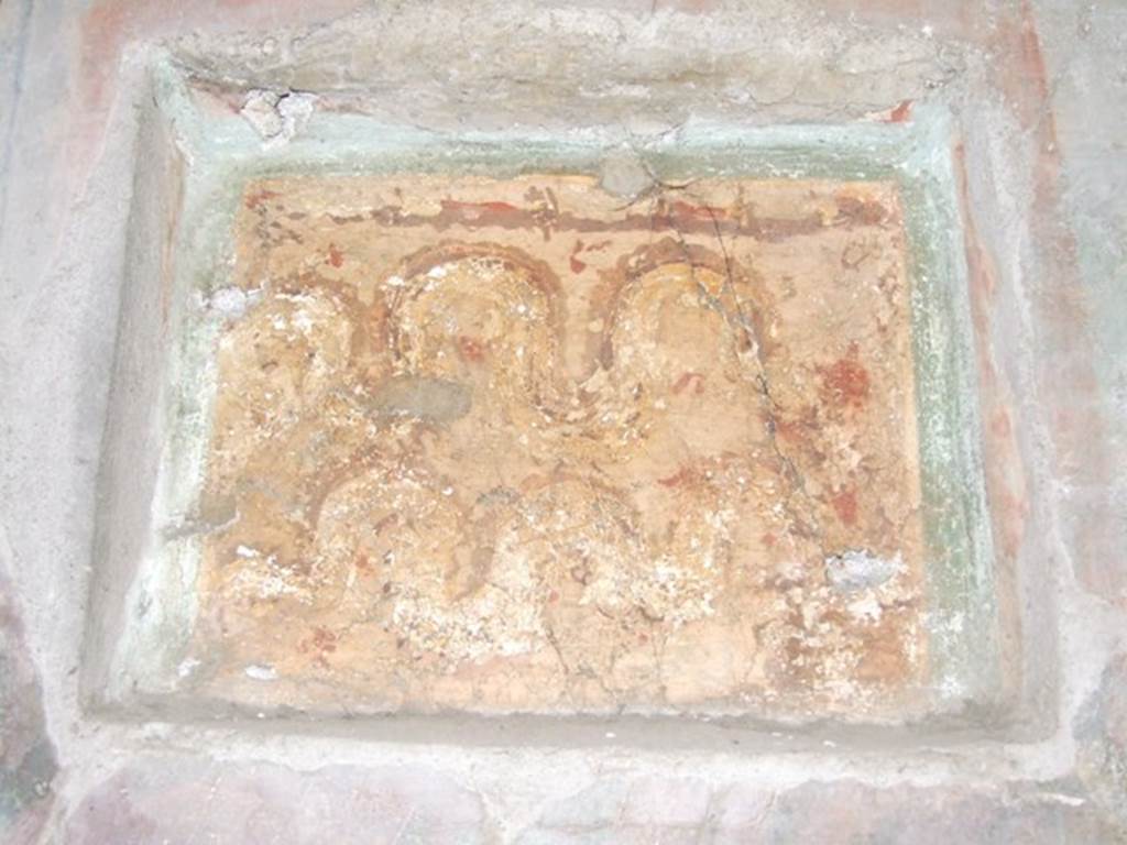 .10.7 Pompeii. March 2009. Room 9, east wall of triclinium. Lararium niche set in third style decoration.
Two crested and bearded brown serpents with yellow underbellies are creeping to the left between red flowers and green plants.
On the right is an altar.
See Fröhlich, T., 1991. Lararien und Fassadenbilder in den Vesuvstädten. Mainz: von Zabern. (L15: p.256)
According to Boyce, this shallow rectangular niche (h.0.40, w.0.52, d.0.09, h. above floor 1.60) was set into (but not in the centre of) a fine panel of wall decoration, which it disfigured.
According to the footnote by Boyce, Elia had said in Not. Scavi, that these panels were painted shortly after the earthquake of 63 AD.
Both serpents coil from the left towards an altar, as in the other lararium described in the kitchen.
In the background were green plants with red flowers.
See Notizie degli Scavi di Antichità, 1934, 287.
See Boyce G. K., 1937. Corpus of the Lararia of Pompeii. Rome: MAAR 14. (p.29, no.57)
See Giacobello, F., 2008. Larari Pompeiani: Iconografia e culto dei Lari in ambito domestico. Milano: LED Edizioni, (p.288, no.C1)

