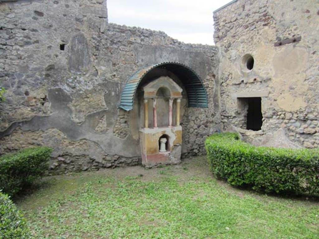 VI.15.8 Pompeii. April 2012. Looking west across garden area towards household shrine. 
Photo courtesy of Marina Fuxa.
