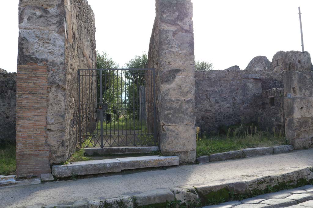 VII.4.52, Pompeii, on right. December 2018. 
Looking towards west wall of shop, on right, with square niche. Photo courtesy of Aude Durand.
