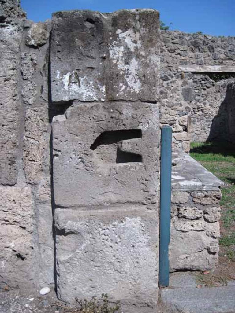 I.1.2 Pompeii. September 2010. North side of exterior wall, dividing I.1.2 and I.1.3, looking east. Photo courtesy of Drew Baker.
