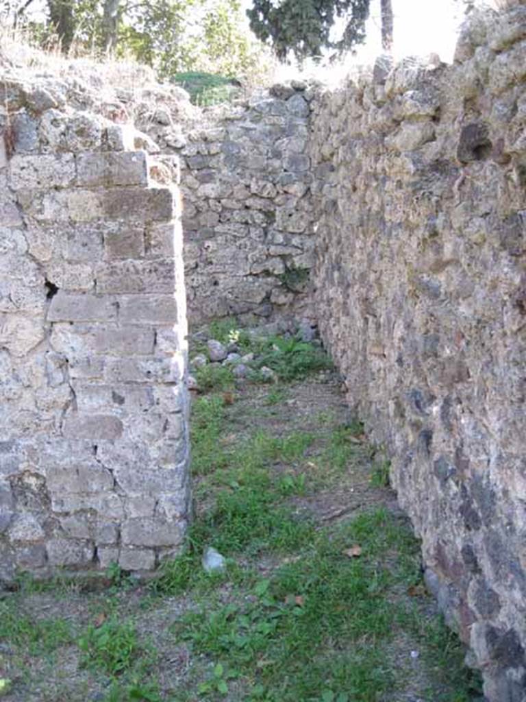 I.1.3 Pompeii. September 2010. 
Doorway in south-west corner to room “i” near south wall. Photo courtesy of Drew Baker.

