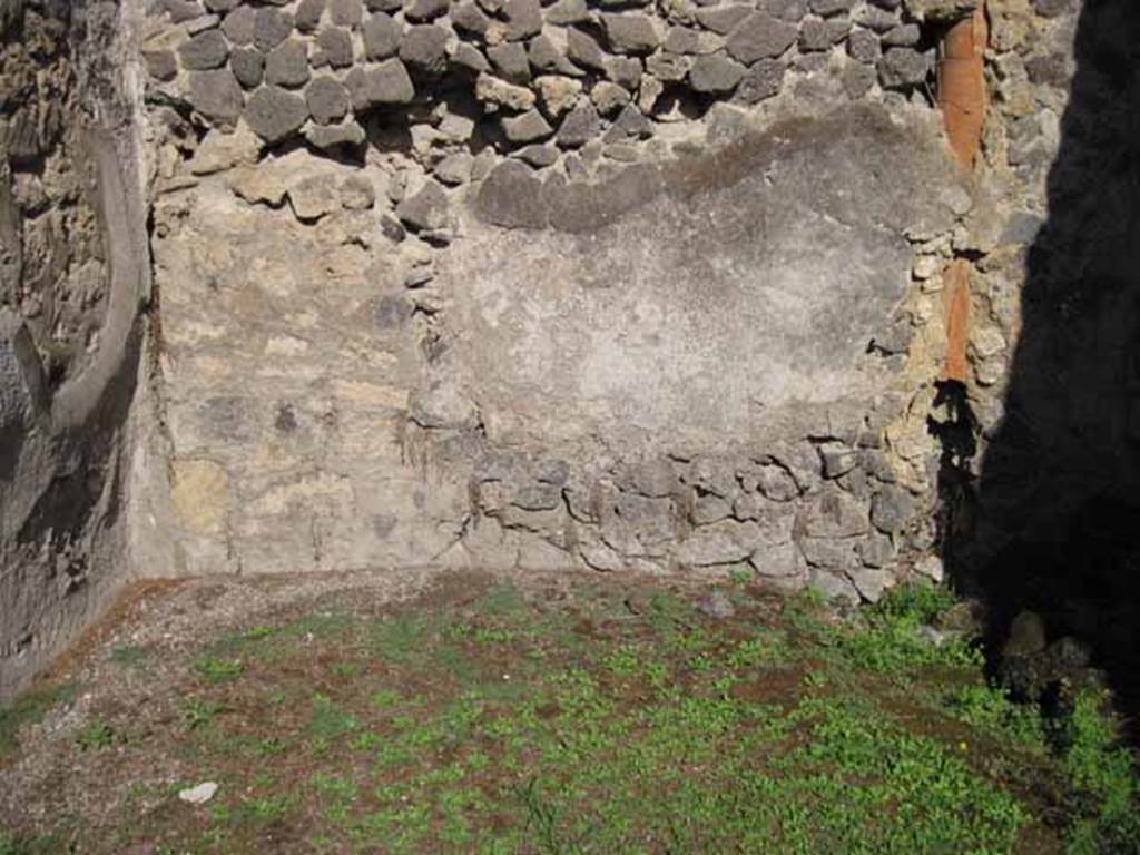 1.2.8 Pompeii. September 2010.  Rear east wall in rear room, with down-pipe from upper floor. Photo courtesy of Drew Baker.
