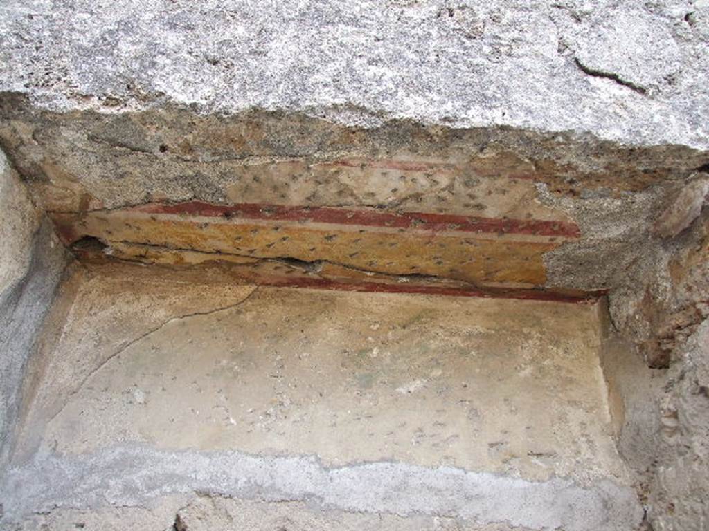 I.2.10 Pompeii. December 2006. South wall of atrium. Decorated plaster in door sized cupboard.