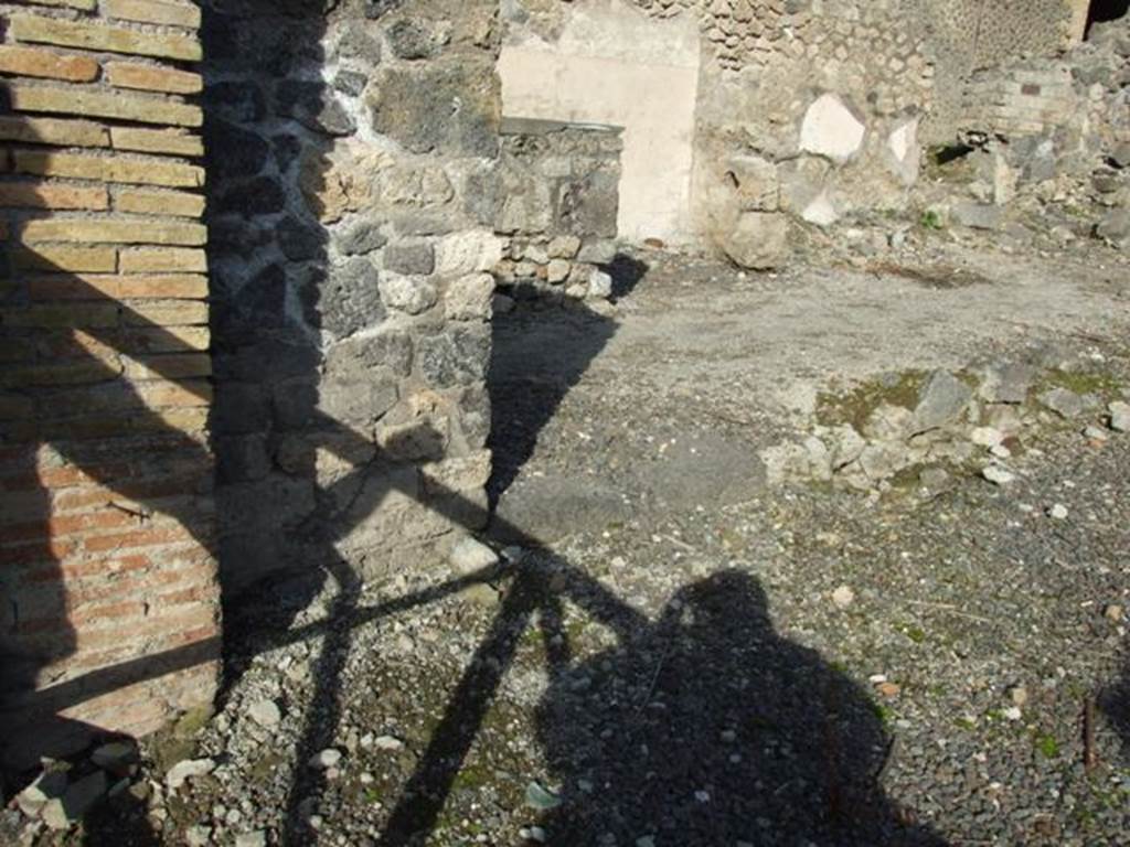 I.2.12 Pompeii. December 2007. Looking north east to remains of north wall and threshold of communicating door to I.2.13.