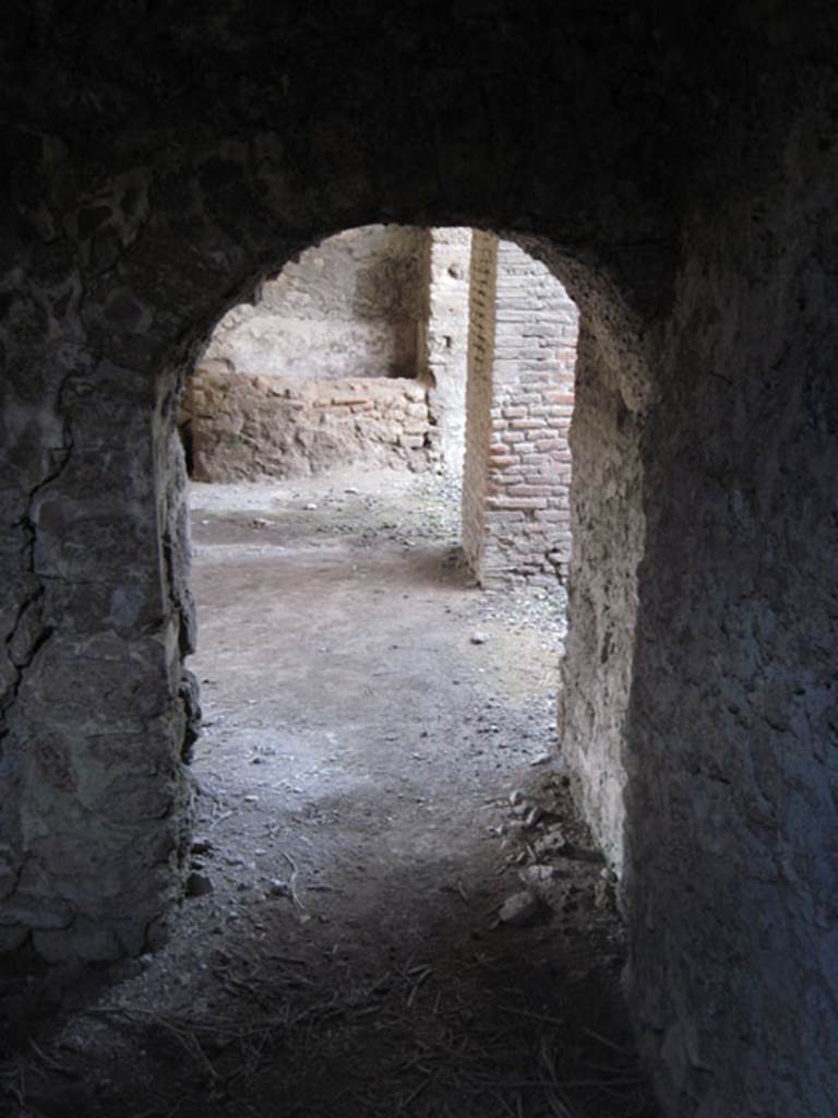 I.3.3 Pompeii. September 2010. Looking west into kitchen through doorway from storeroom.
Photo courtesy of Drew Baker.
