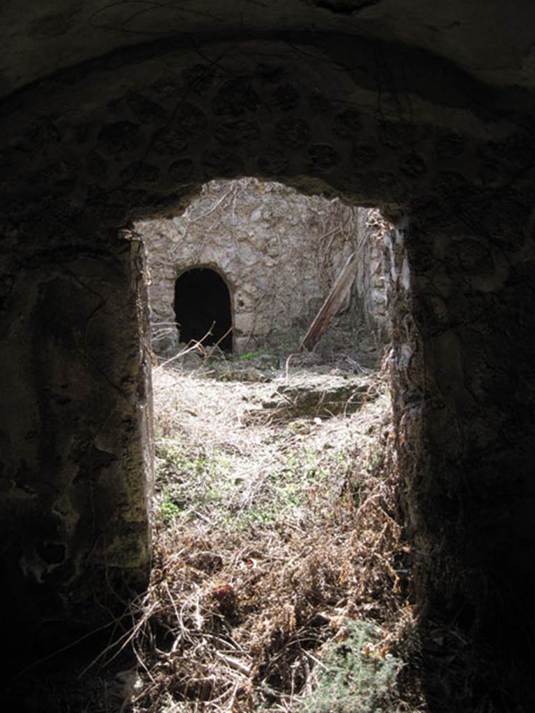 I.3.3 Pompeii. September 2010. Subterranean Level, looking south through doorway into room on east side of yard room and across to room on south side. Photo courtesy of Drew Baker.
