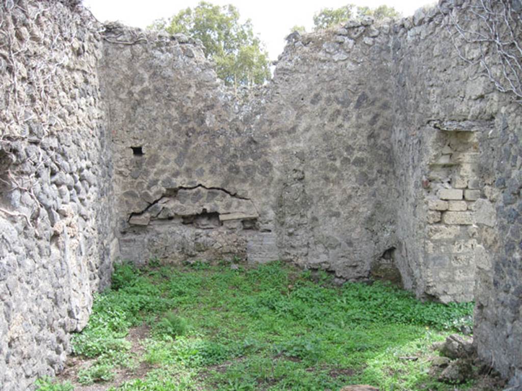 I.3.3 Pompeii. September 2010. Upper peristyle area, south wall of large kitchen, with doorway leading to east portico, on right. Photo courtesy of Drew Baker.
