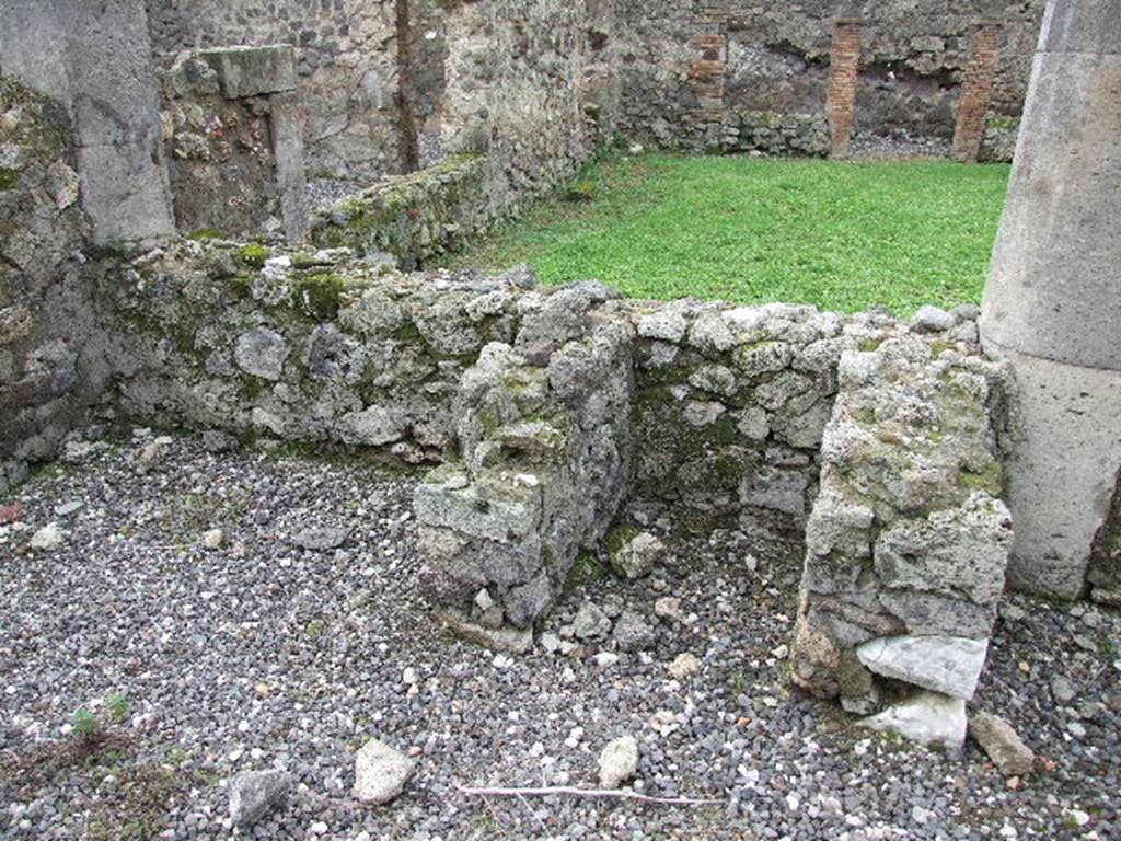 I.3.8b Pompeii. December 2006. Looking west across peristyle towards remains of hearth.