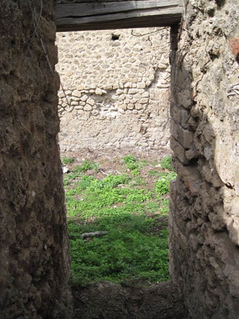 I.3.27 Pompeii. September 2010. Looking north from latrine or narrow room, towards bakery room. Photo courtesy of Drew Baker.
