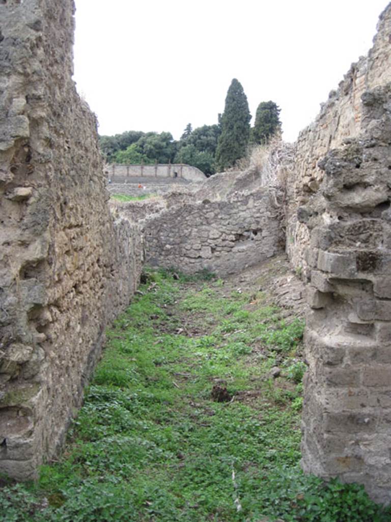 I.3.27 Pompeii. September 2010. Looking west into doorway of room at north end of western side of bakery room. Photo courtesy of Drew Baker.
