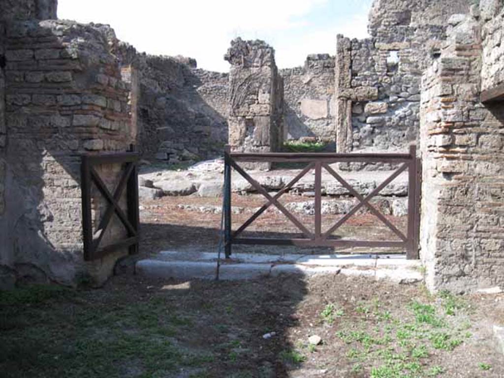 I.5.2 Pompeii. September 2010. Looking north across shop-room towards entrance doorway looking onto Vicolo del Conciapelle. The doorway on the right (east side) leads to a small area beneath the stairway. Photo courtesy of Drew Baker.

