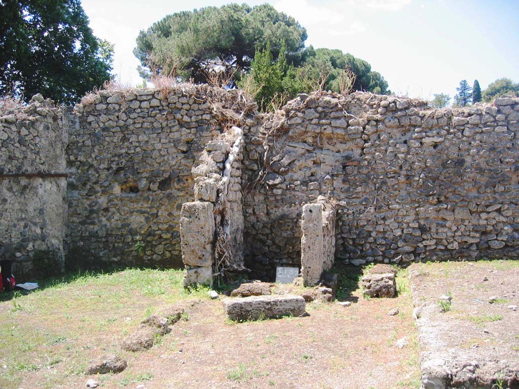 I.5.2 Pompeii. July 2008. 
Looking west to south-west corner and west wall of peristyle area, showing small room with latrine. Photo courtesy of Barry Hobson.
