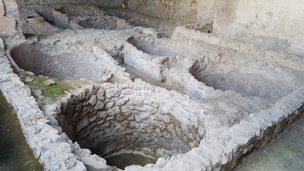 I.5.2 Pompeii. August 2023. Looking south-east towards south wall of industrial room. Photo courtesy of Maribel Velasco.