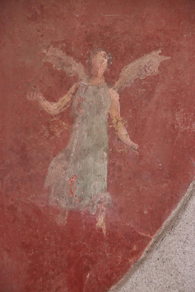 I.6.4 Pompeii. October 2024.
Room 5, detail of flying figure from north end of east wall. Photo courtesy of Klaus Heese. 
