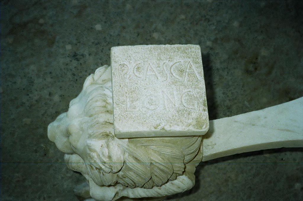 I.6.11 Pompeii. June 2010. On top of the first table leg is P(VBLIVS) CASCA LONG(INVS). 
See Della Corte, M., 1965.  Case ed Abitanti di Pompei. Napoli: Fausto Fiorentino. (p. 285).  Photo courtesy of Rick Bauer.

