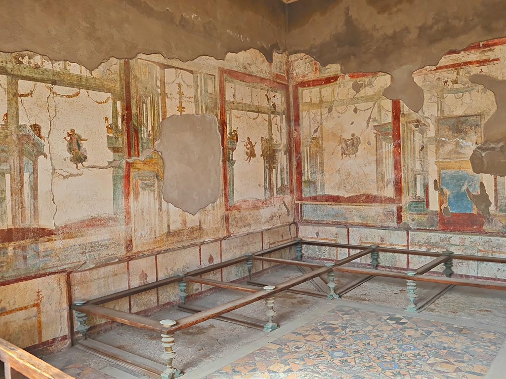 I.7.11 Pompeii. March 2024. Looking north-west across triclinium. Photo courtesy of Giuseppe Ciaramella.