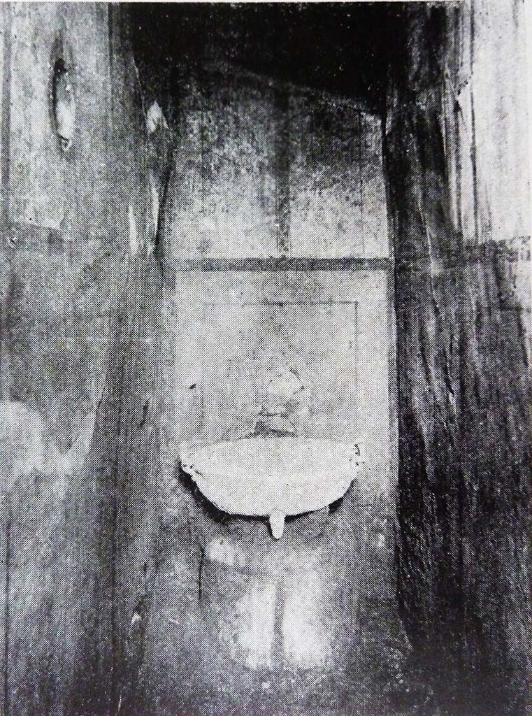 I.7.11 Pompeii. Old undated photograph showing small room with bronze basin, when first excavated.