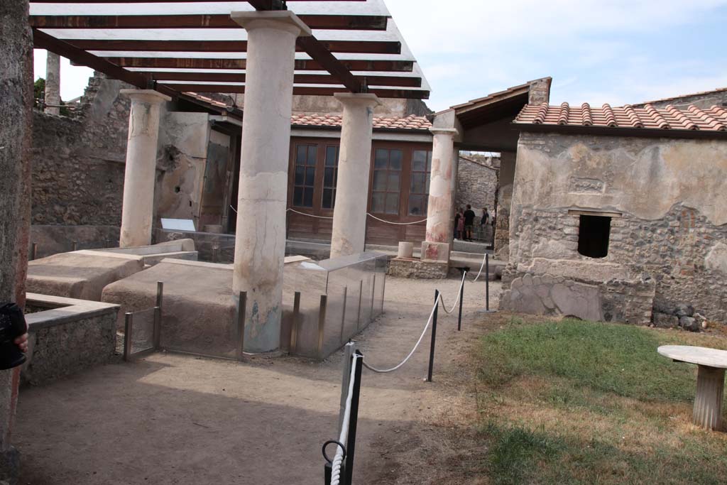 I.7.12 Pompeii. September 2021. Looking north-west across garden area with summer triclinium. Photo courtesy of Klaus Heese.