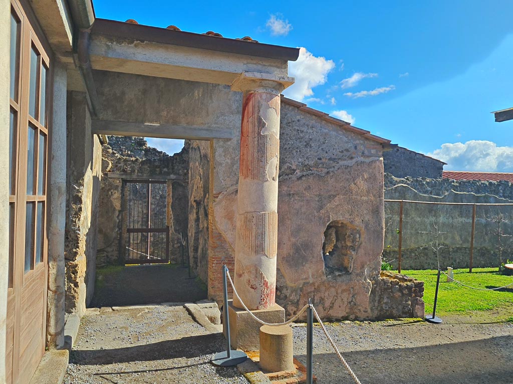 I.7.12 Pompeii. March 2024. Looking east along north portico towards entrance doorway. Photo courtesy of Giuseppe Ciaramella.