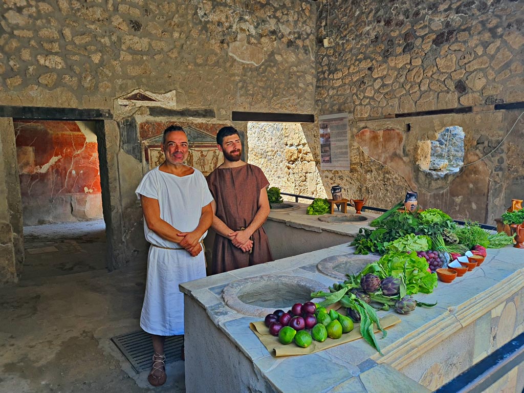 I.8.8 Pompeii. 8th June 2024. Looking south-west across counter. Photo courtesy of Giuseppe Ciaramella.
Historical reconstruction entitled L’altra Pompei prende vita (The other Pompeii comes to life).
