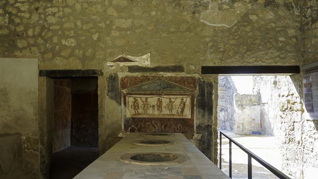 I.8.8 Pompeii. August 2021. Looking south towards rear wall with lararium. Photo courtesy of Robert Hanson.

