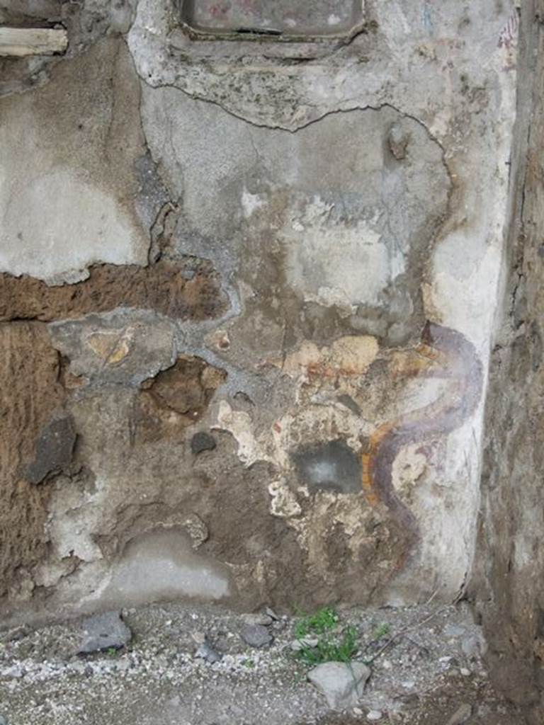 I.8.10 Pompeii. March 2009. Lararium on north wall, on east side of door to underground kitchen.