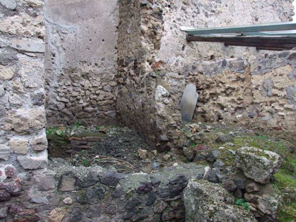 I.8.14 Pompeii. December 2007. 
Room (11), latrine, and room (10), kitchen, two rooms against north wall to north of courtyard area 7, behind fallen wall.


