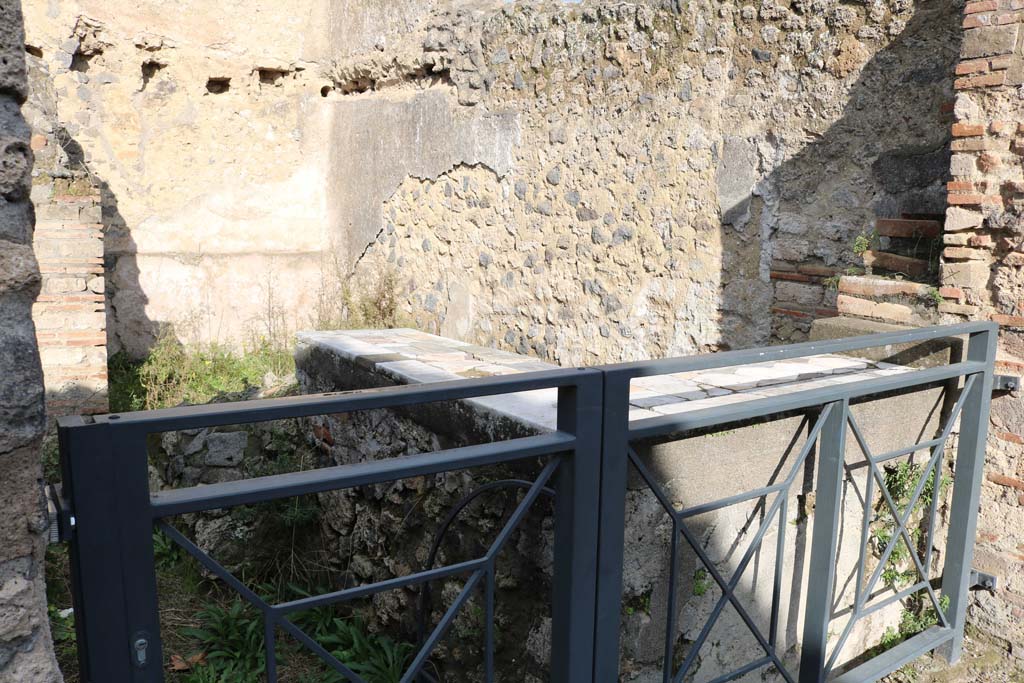 I.9.11 Pompeii. December 2018. Looking north-east across counter in bar-room. Photo courtesy of Aude Durand.