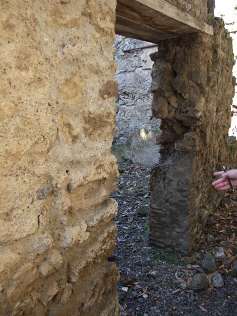 I.10.4 Pompeii. March 2009. Doorway to room 28, on east side of kitchen.