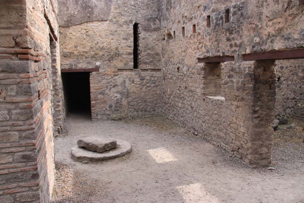 I.10.14 Pompeii.  September 2021. 
Looking south in room with well, and with doorway and window in west wall, on right. Photo courtesy of Klaus Heese.
