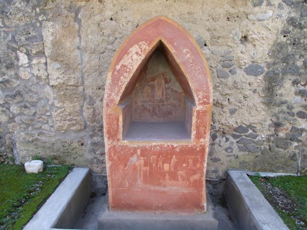 I.14.7 Pompeii. March 2009. 
Lararium against south wall of garden area, with water channel around base.
See Frhlich, T., 1991. Lararien und Fassadenbilder in den Vesuvstdten. Mainz: von Zabern, L33, p. 262-3, Taf. 5,1.
