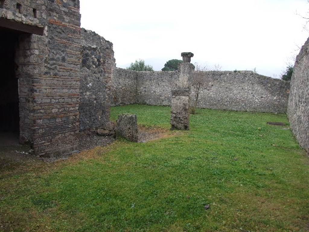 I.16.4 Pompeii. December 2006.Looking south across garden with doorway to summer triclinium, on left, and porticus at rear.